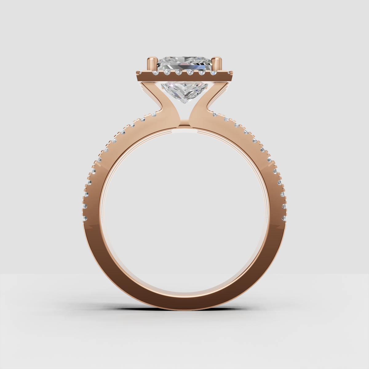Gold princess engagement ring with square center stone