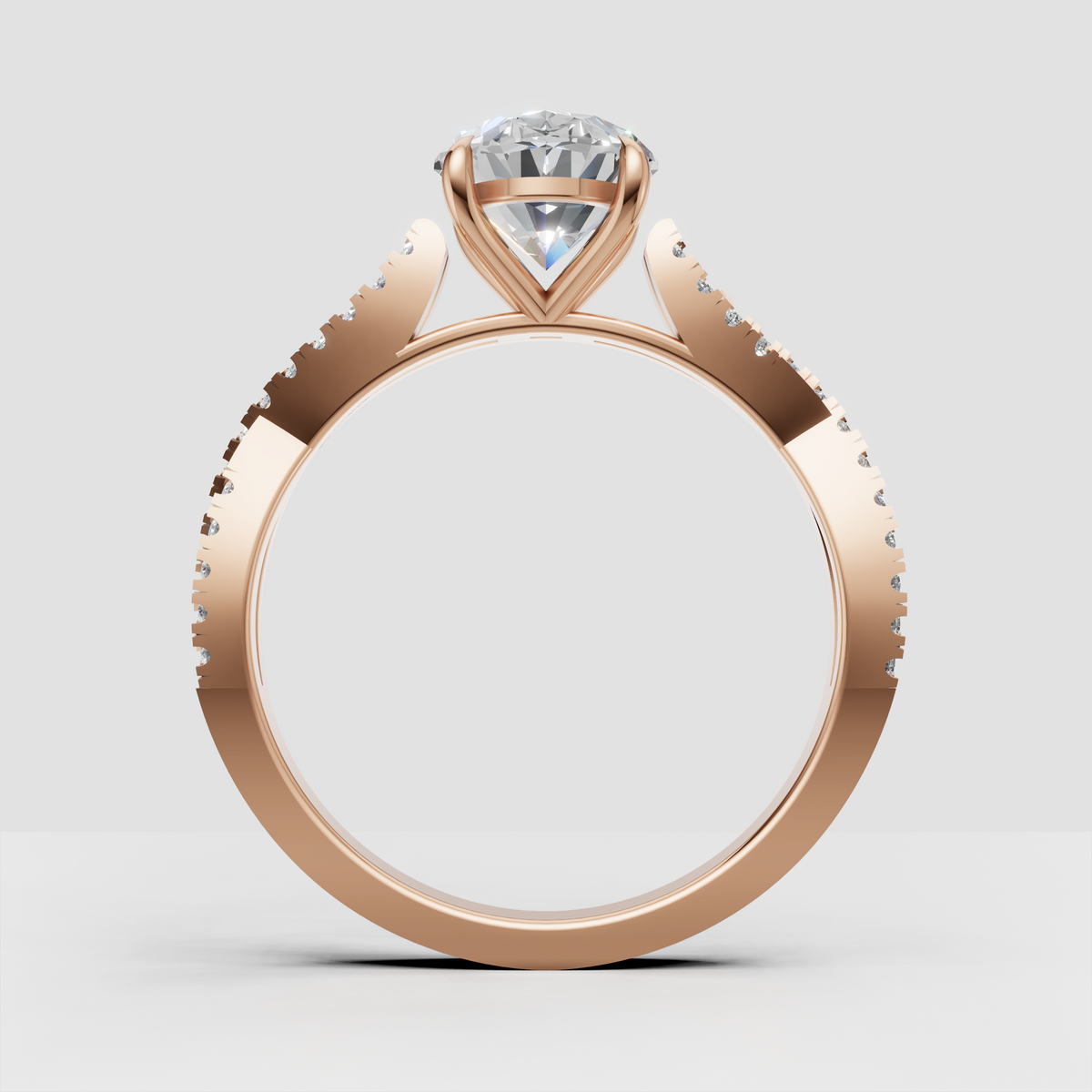 Pear shaped diamond ring with four-prong center setting and pavé band