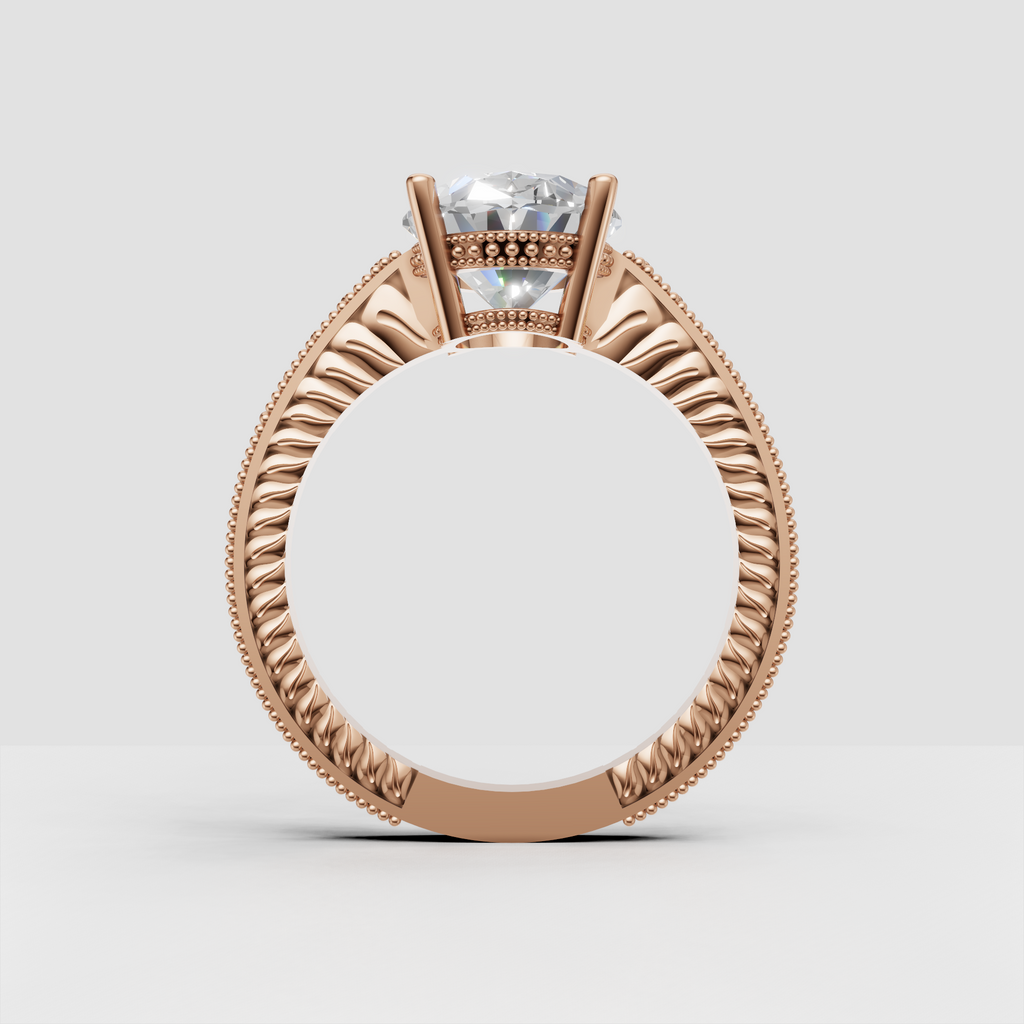 Oval center stone engagement ring with intricate gold craftsmanship