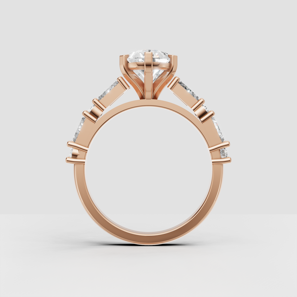 Six-prong pear cut engagement ring with baguette accents