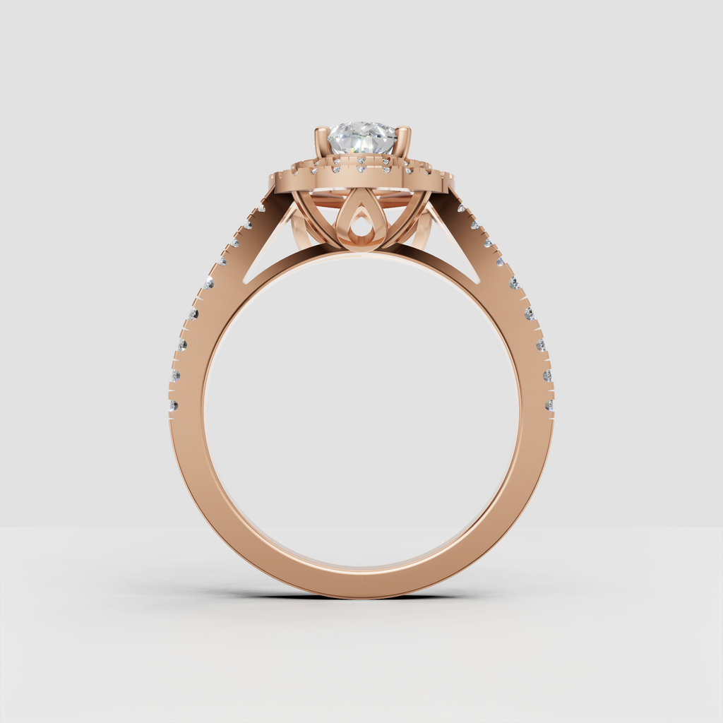 Pear diamond ring featuring a split-shank pave band