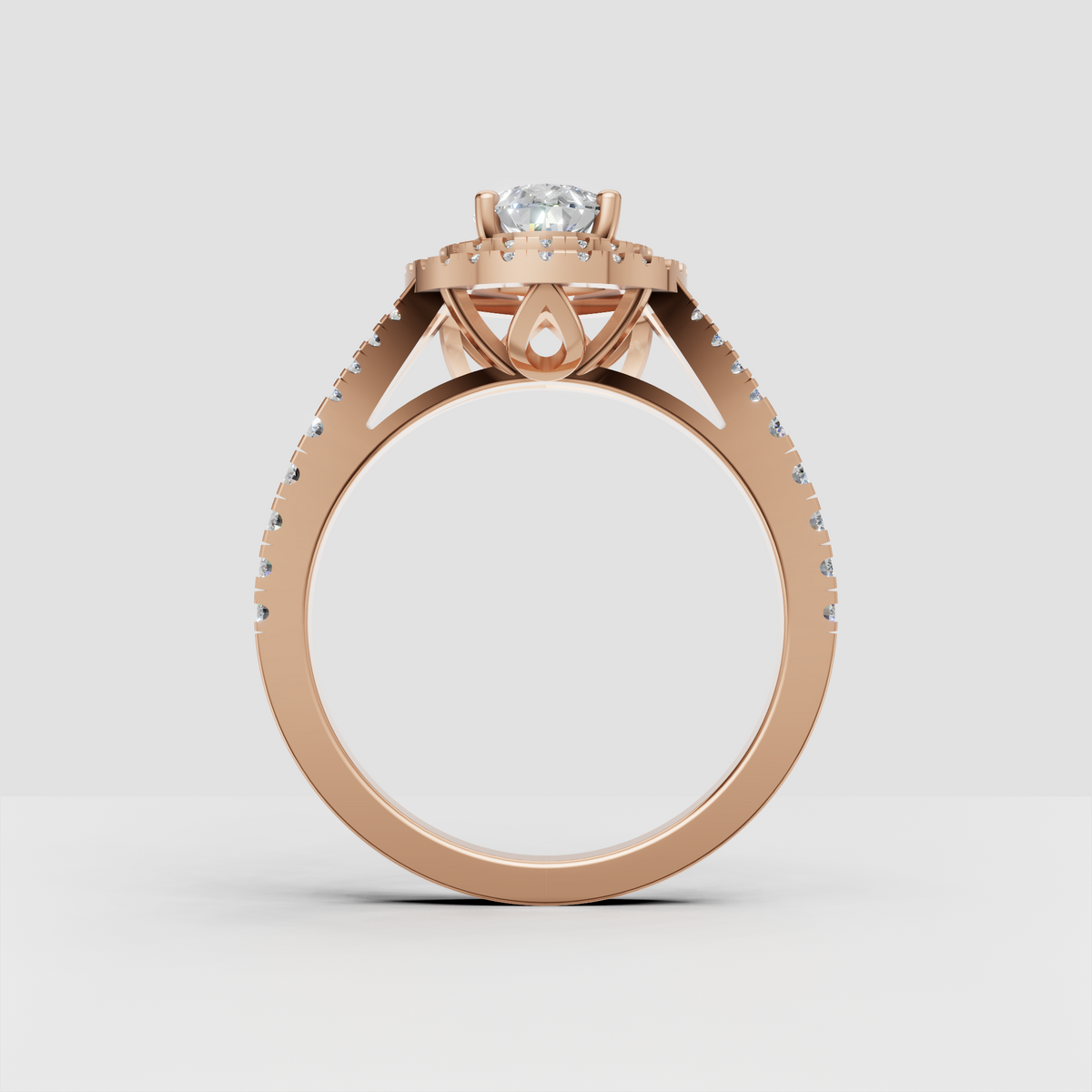 Pear diamond ring featuring a split-shank pave band