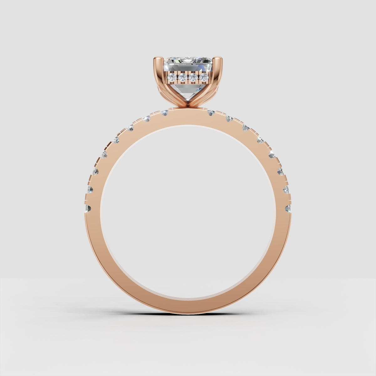 Emerald cut diamond bridal ring with four-prong gold setting