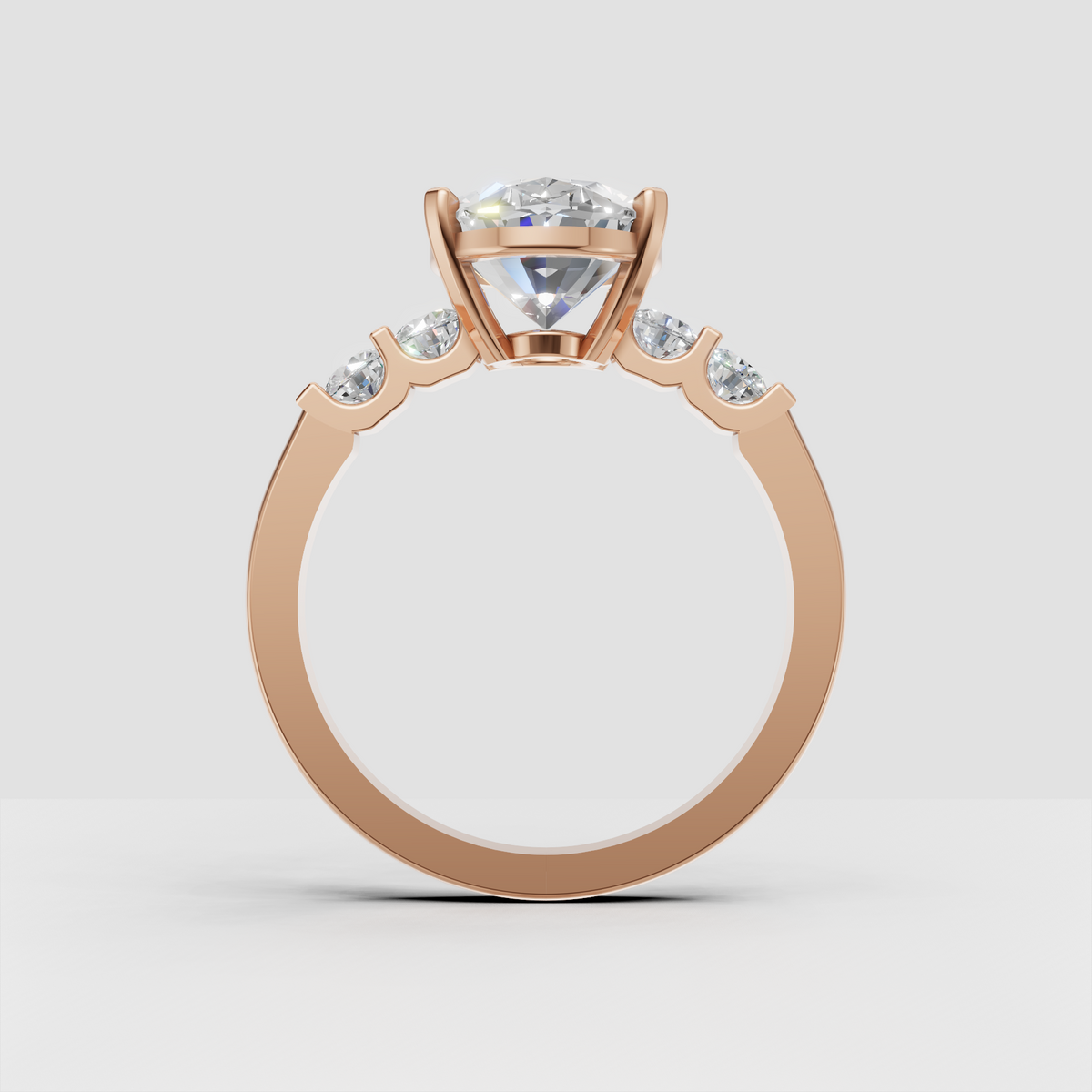 Elegant five stone diamond ring with oval center and round accent stones