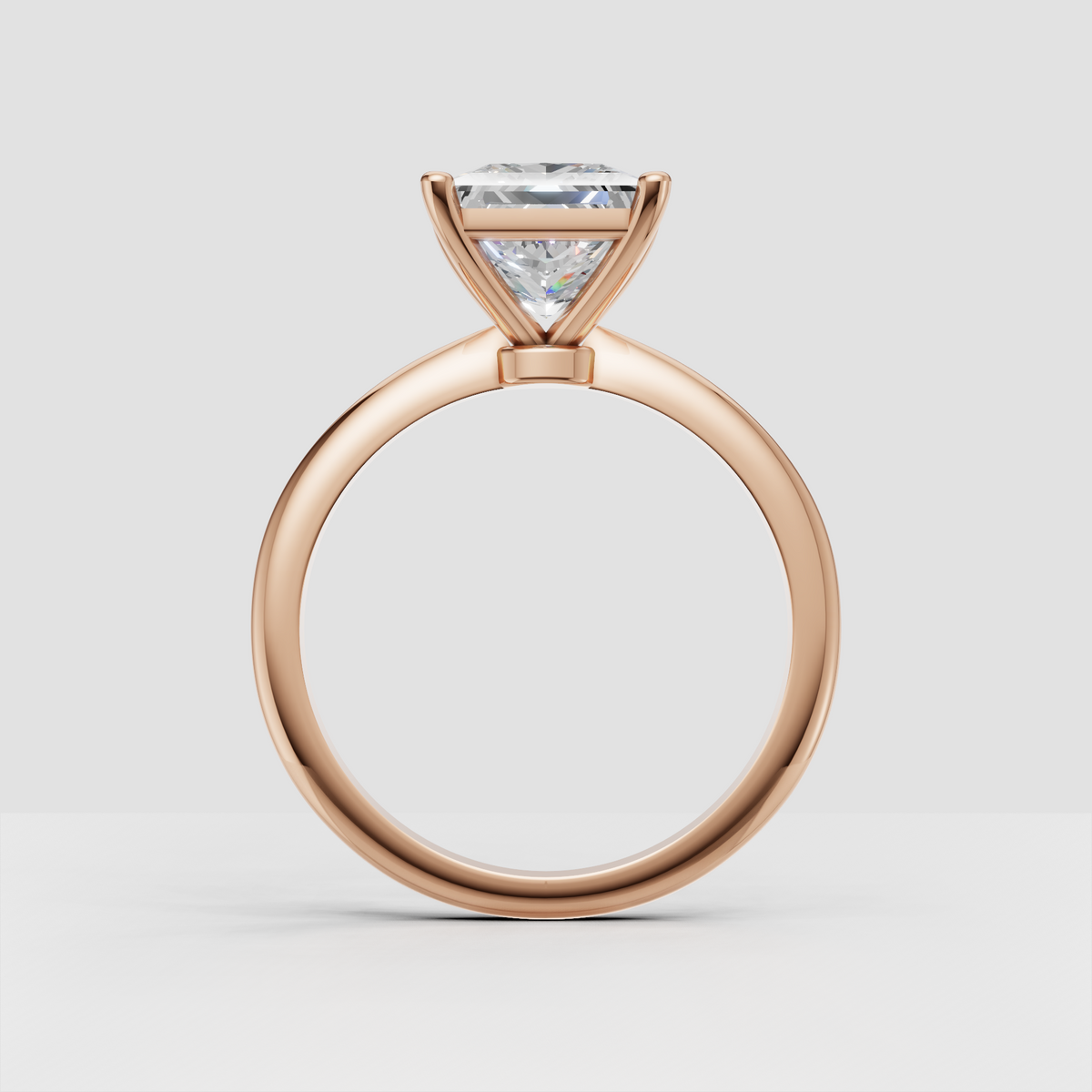 Four prong princess cut diamond ring with elegant minimalist gold setting