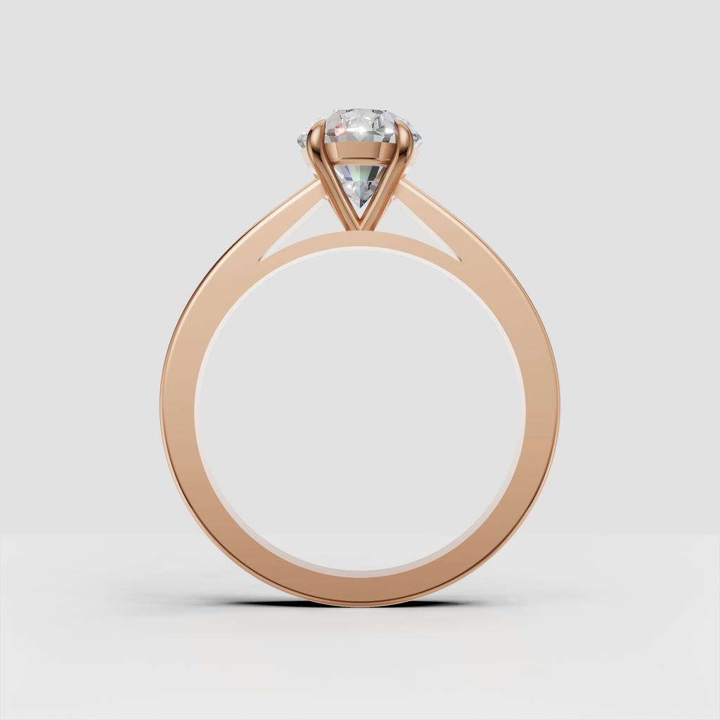 Four-prong oval diamond engagement ring in gold