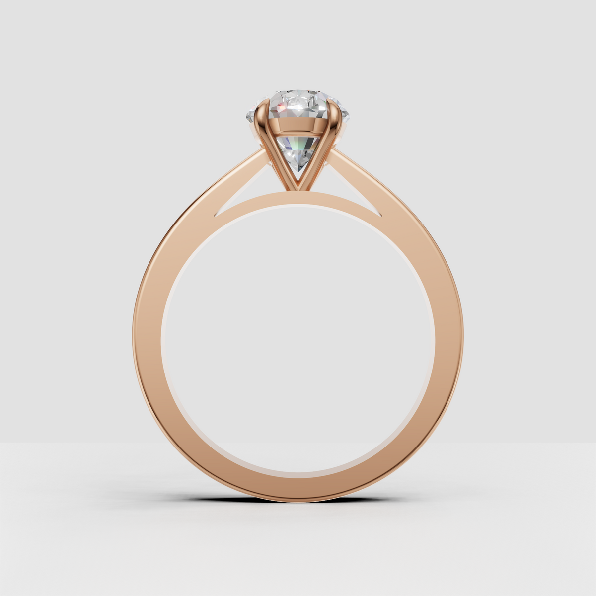 Four-prong oval diamond engagement ring in gold
