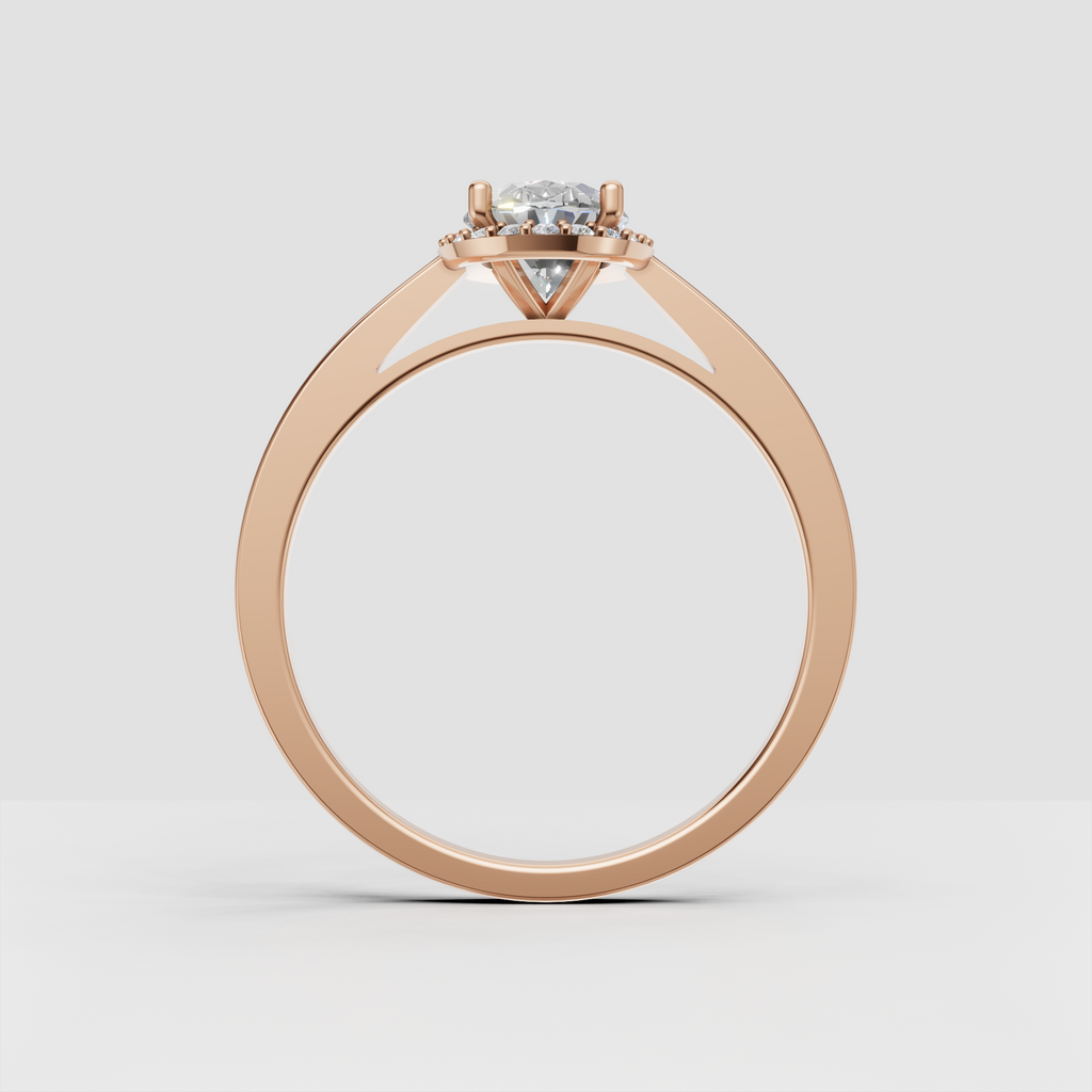 Oval diamond engagement ring with symmetrical halo detailing