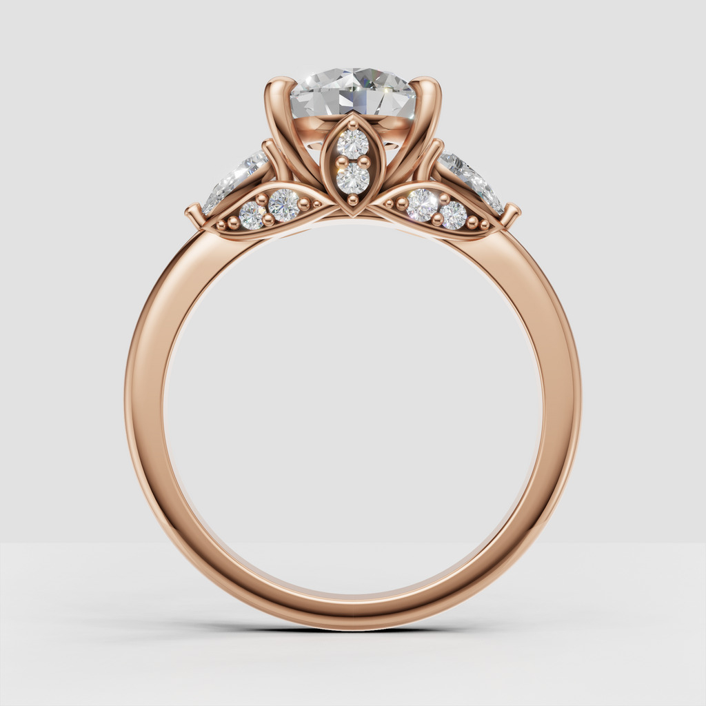 Luxury yellow gold three stone engagement ring with botanical gallery