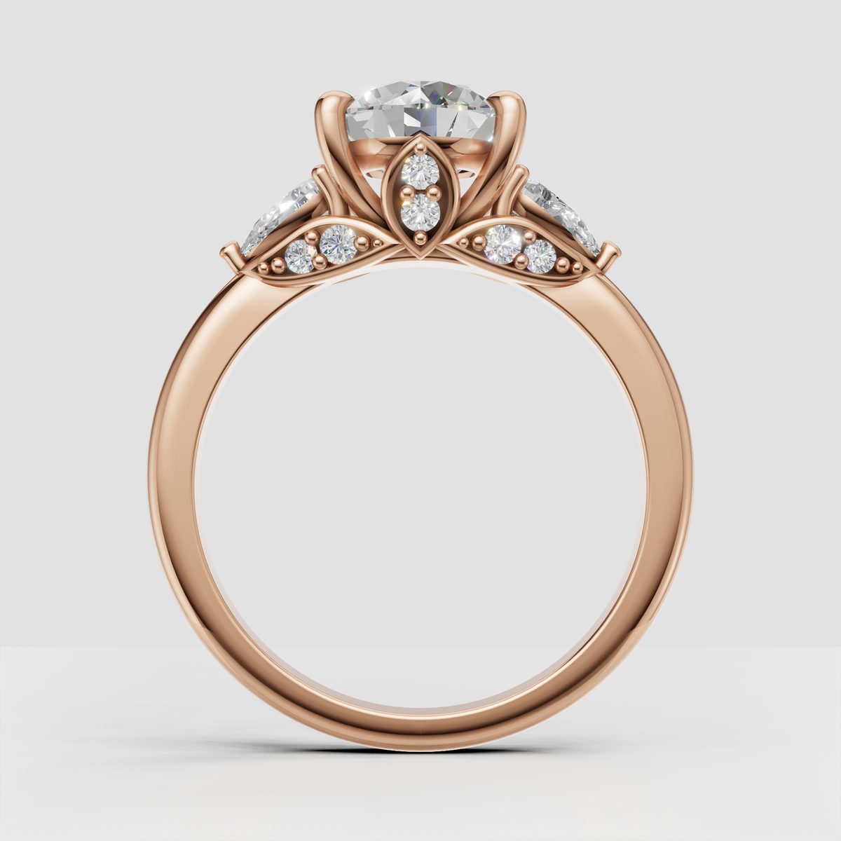 Luxury yellow gold three stone engagement ring with botanical gallery