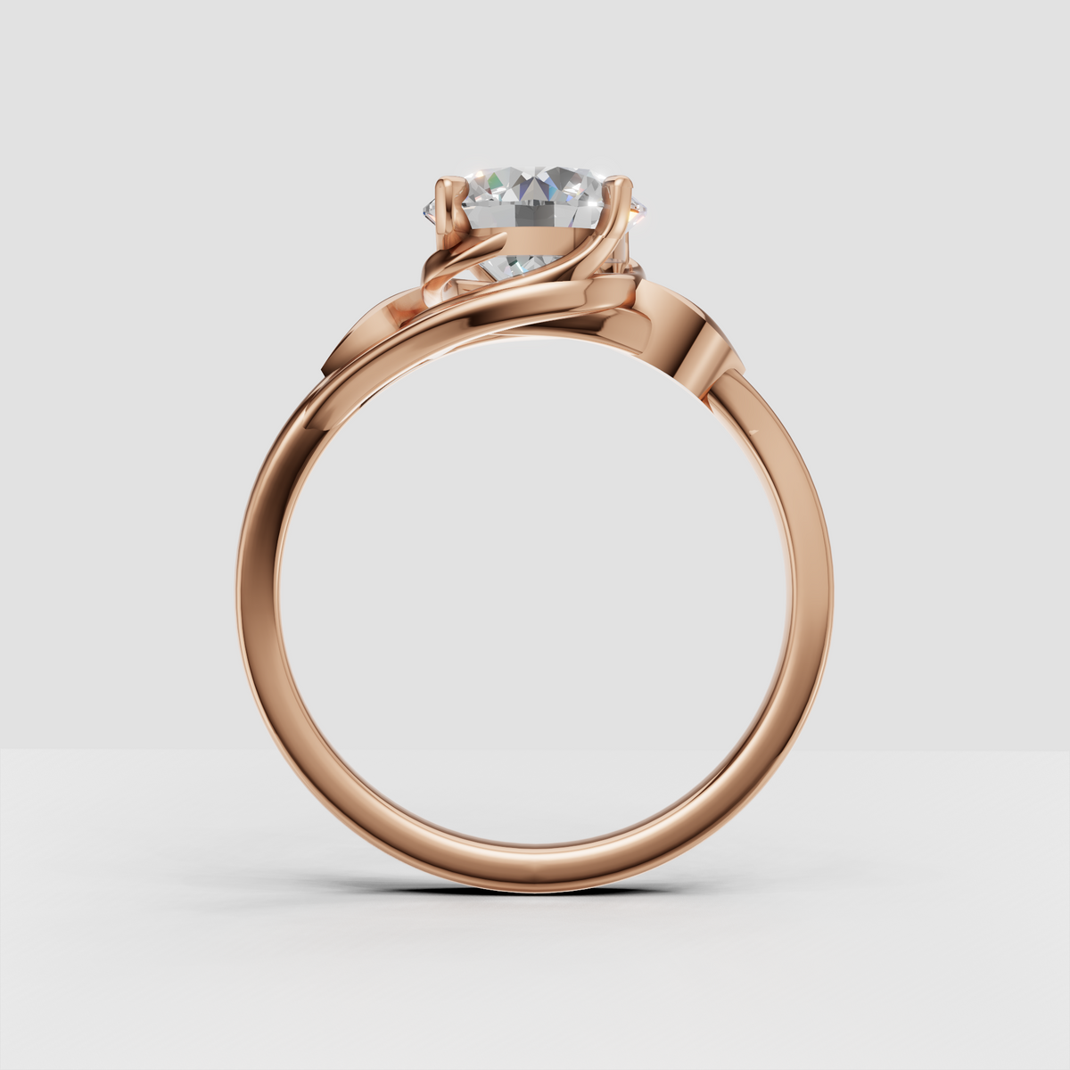 Round diamond solitaire ring with elevated basket setting and leaf motifs