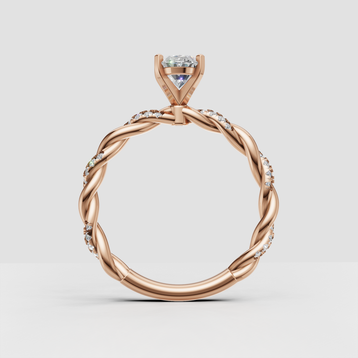 Interwoven gold band with oval center diamond