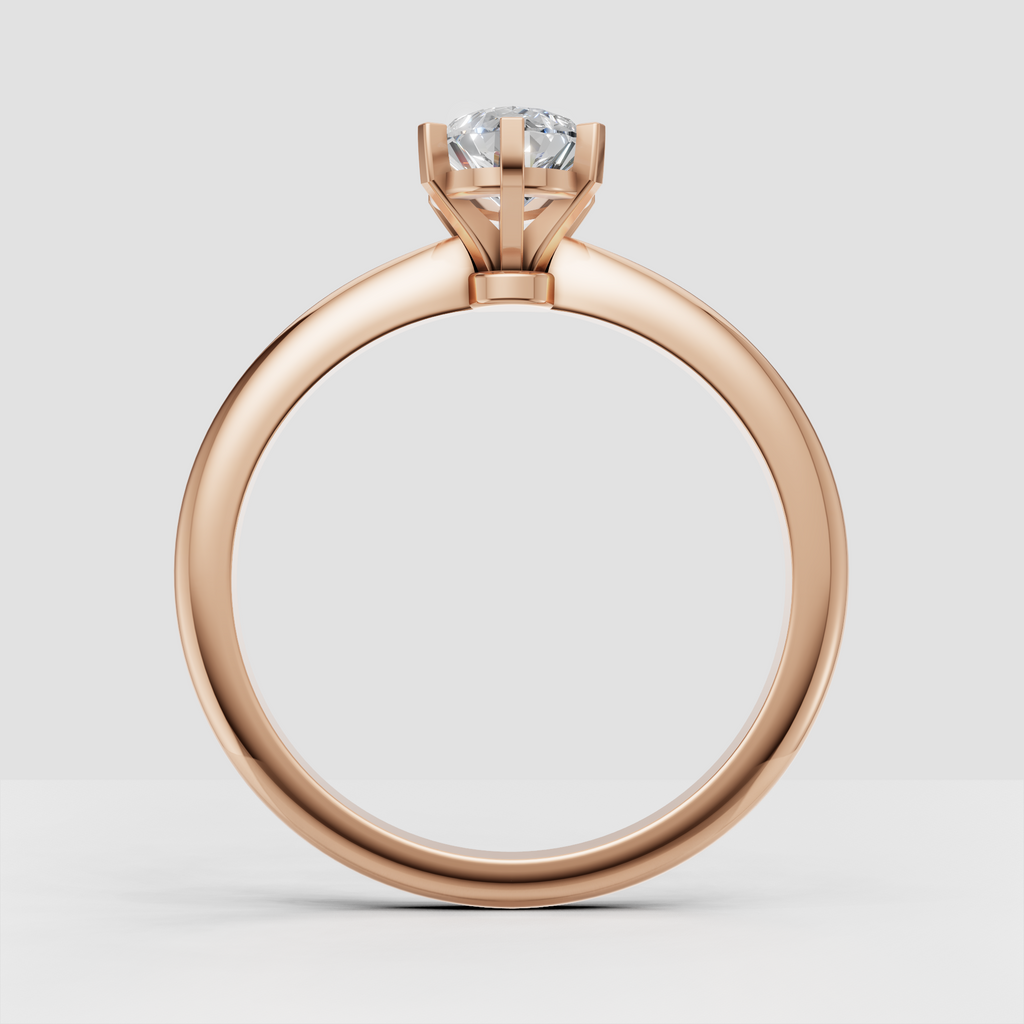 Pear cut center stone secured in a six prong engagement ring setting