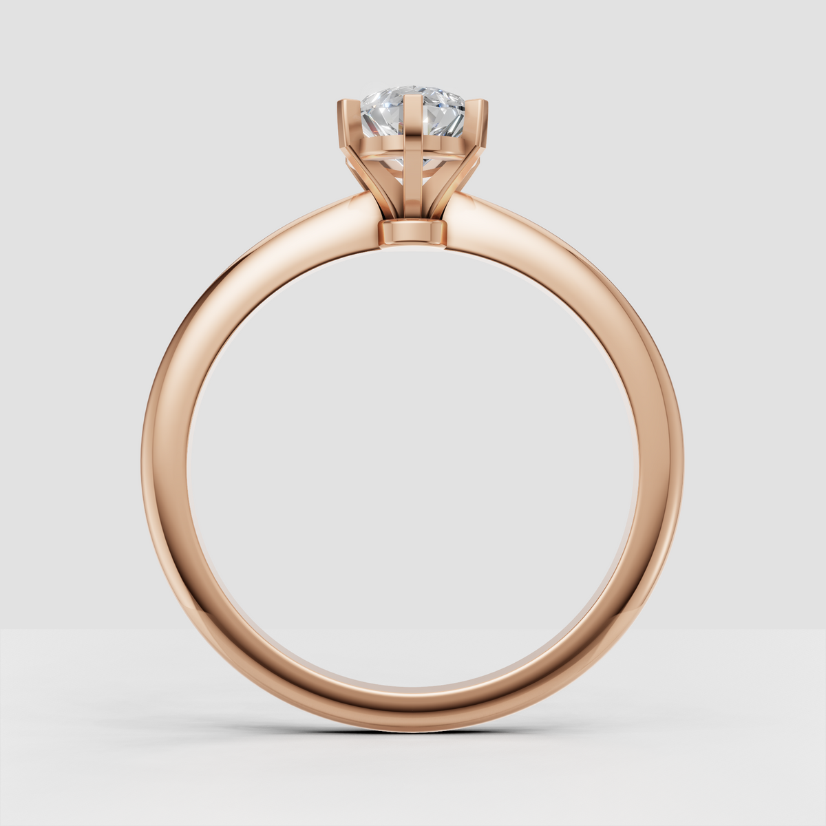 Pear cut center stone secured in a six prong engagement ring setting
