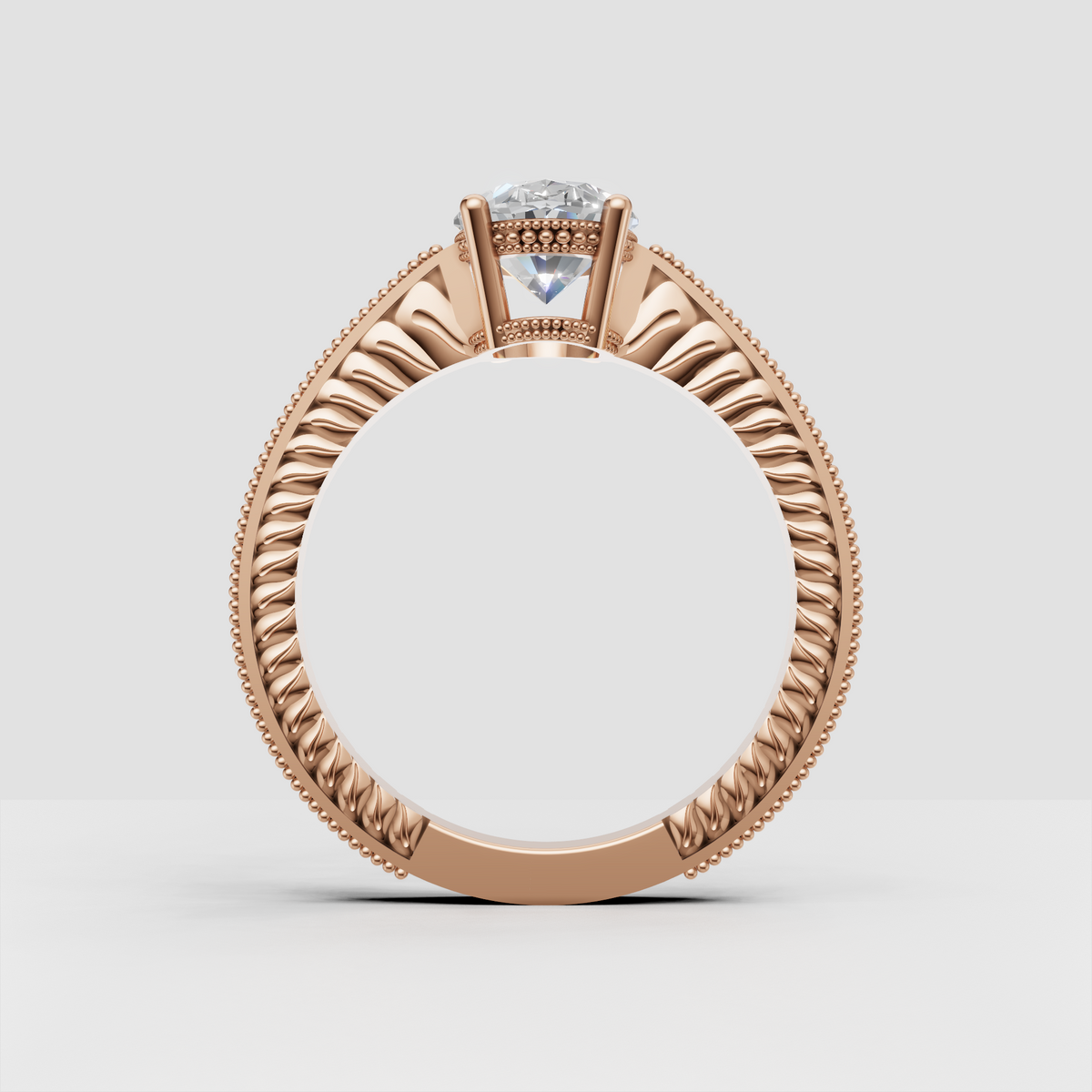 Four-prong oval diamond engagement ring with decorative side stone shoulders