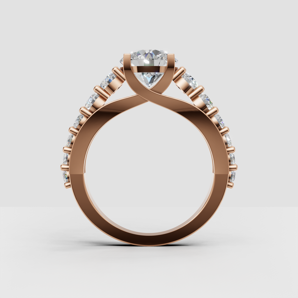 Round cut diamond engagement ring with crossover shoulder design