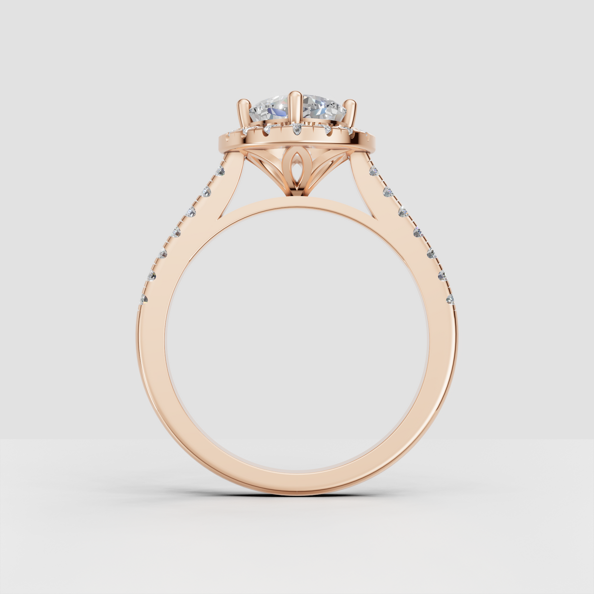 Four-prong cushion cut diamond engagement ring with full halo design