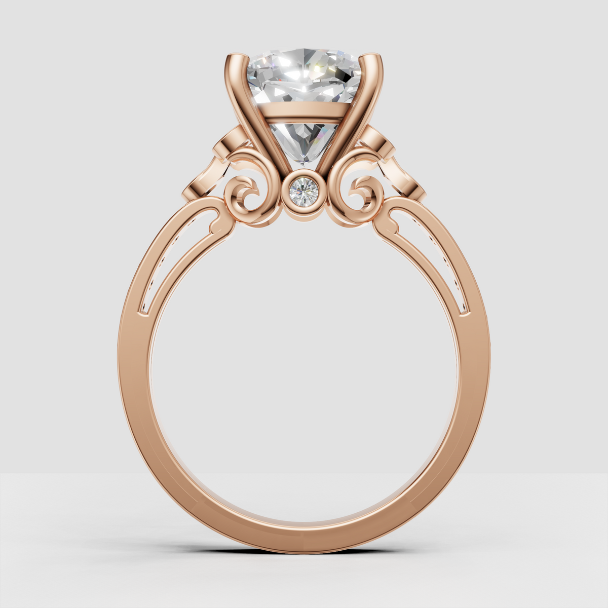 Cushion center diamond secured by rounded gold prongs
