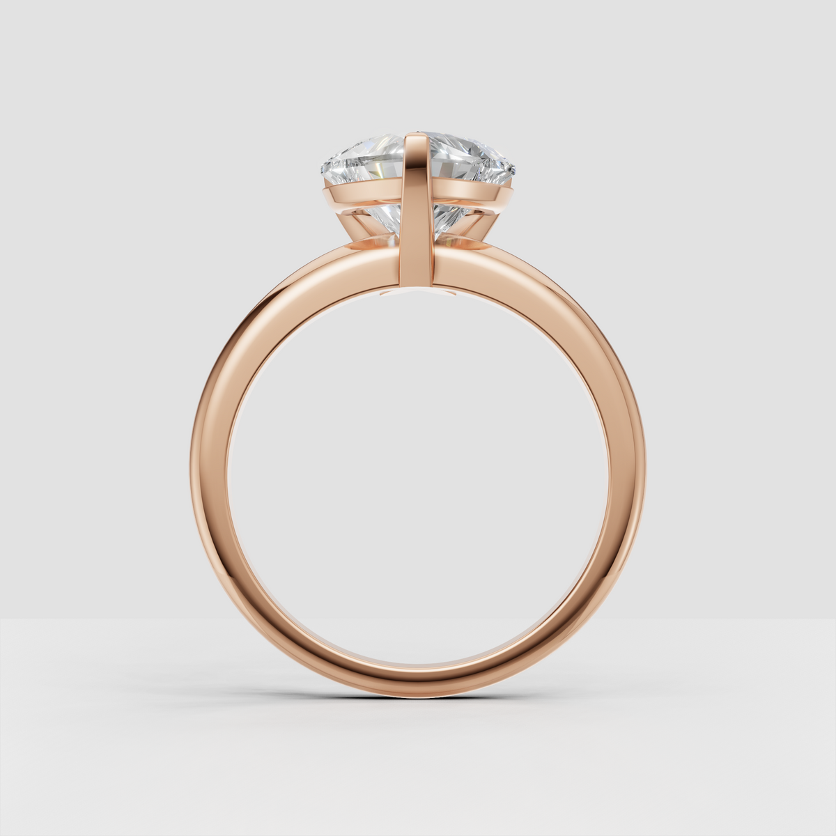 Sophisticated heart diamond solitaire ring viewed from the side