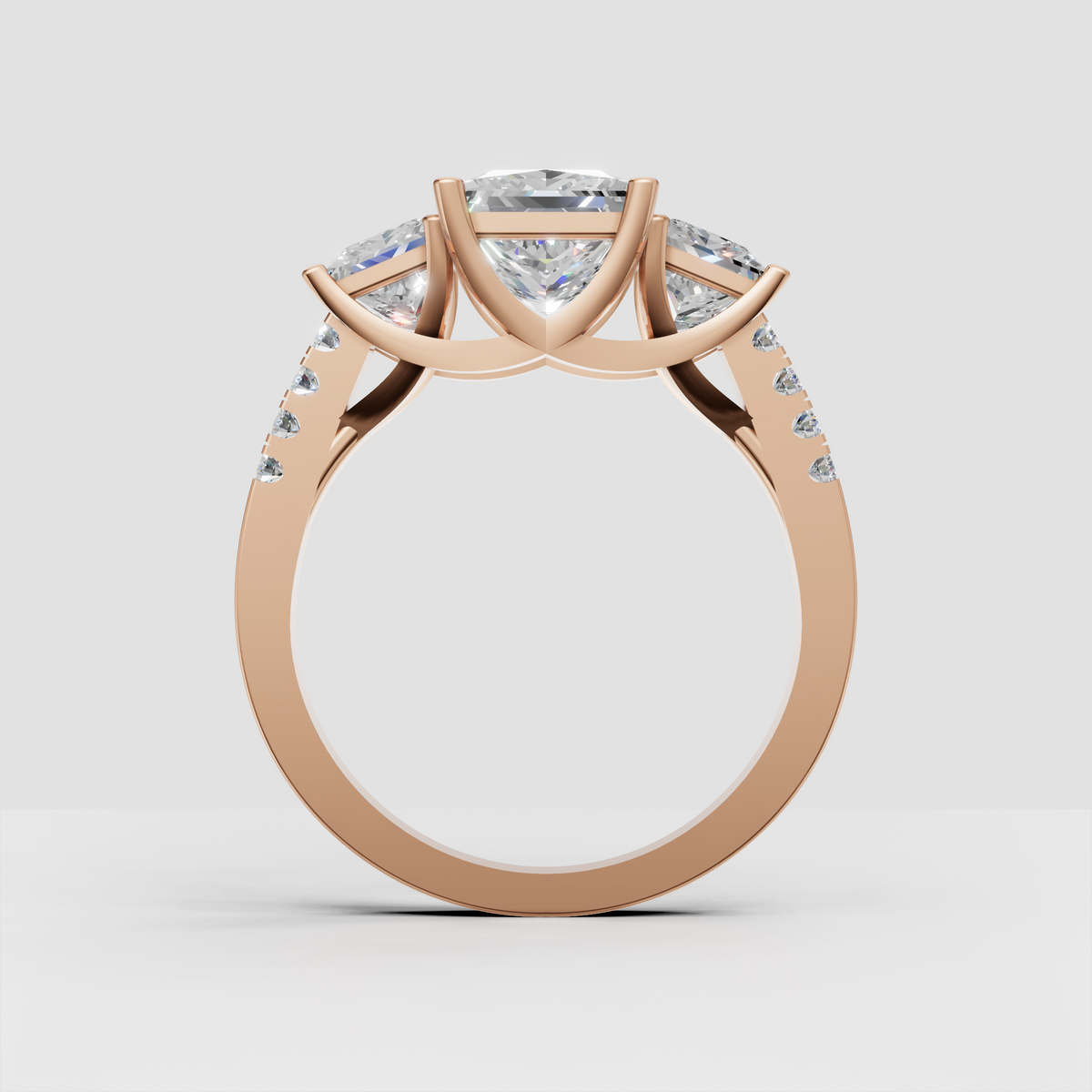 Princess cut center stone three stone wedding ring