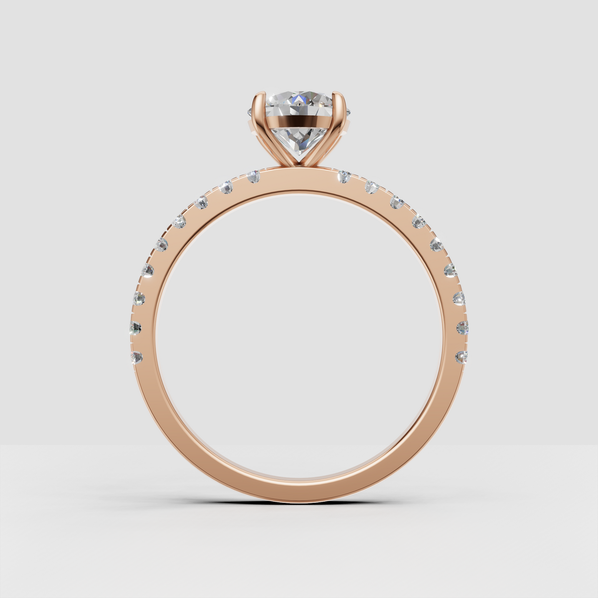 Delicate yellow gold engagement ring with round cut center stone