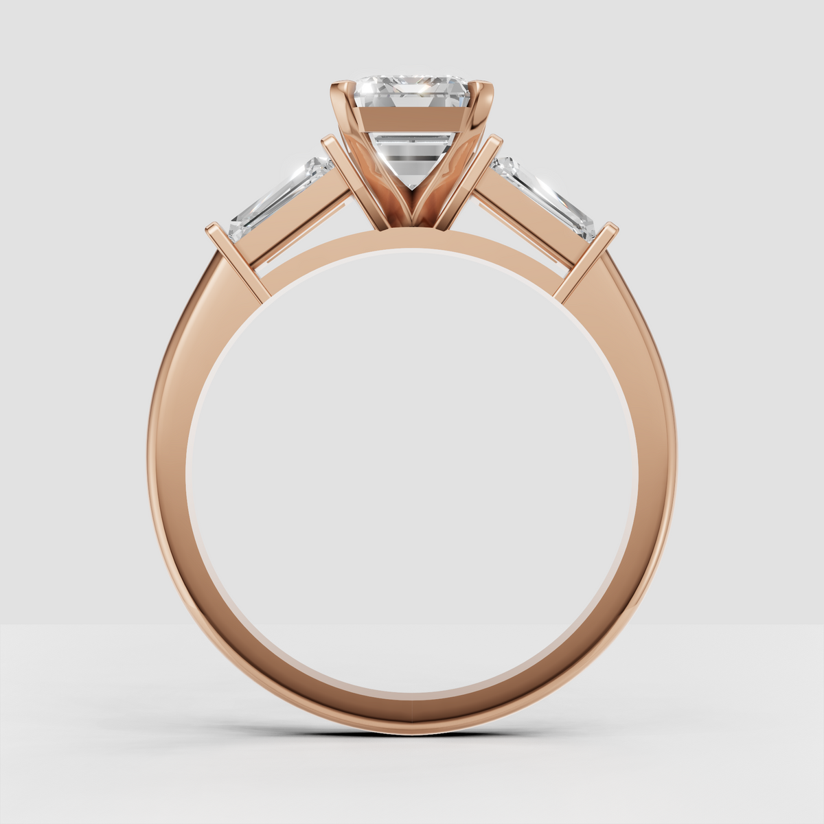 Emerald cut diamond ring showing baguette accents on both shoulders