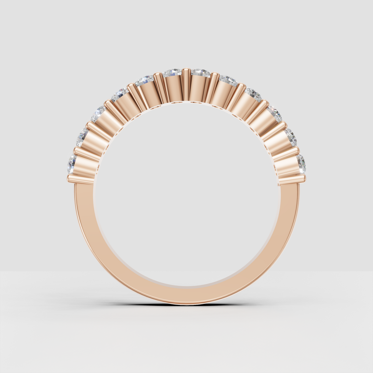 Round brilliant diamond band with continuous gemstone coverage and gold settings
