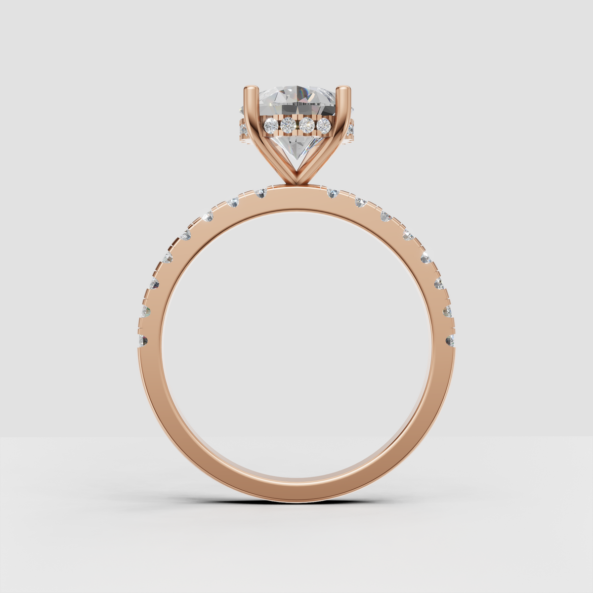 Pear cut diamond ring with delicate round accent stones