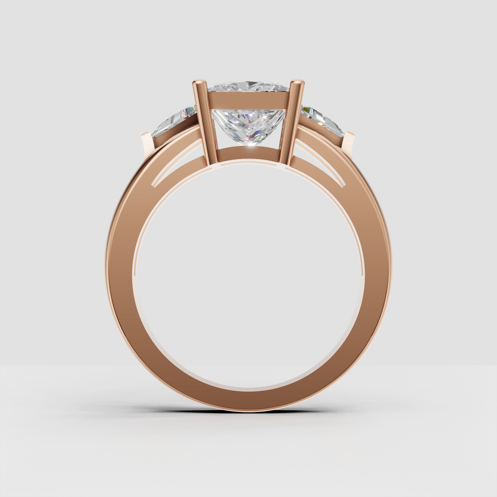 Perspective view of yellow gold three stone princess engagement ring