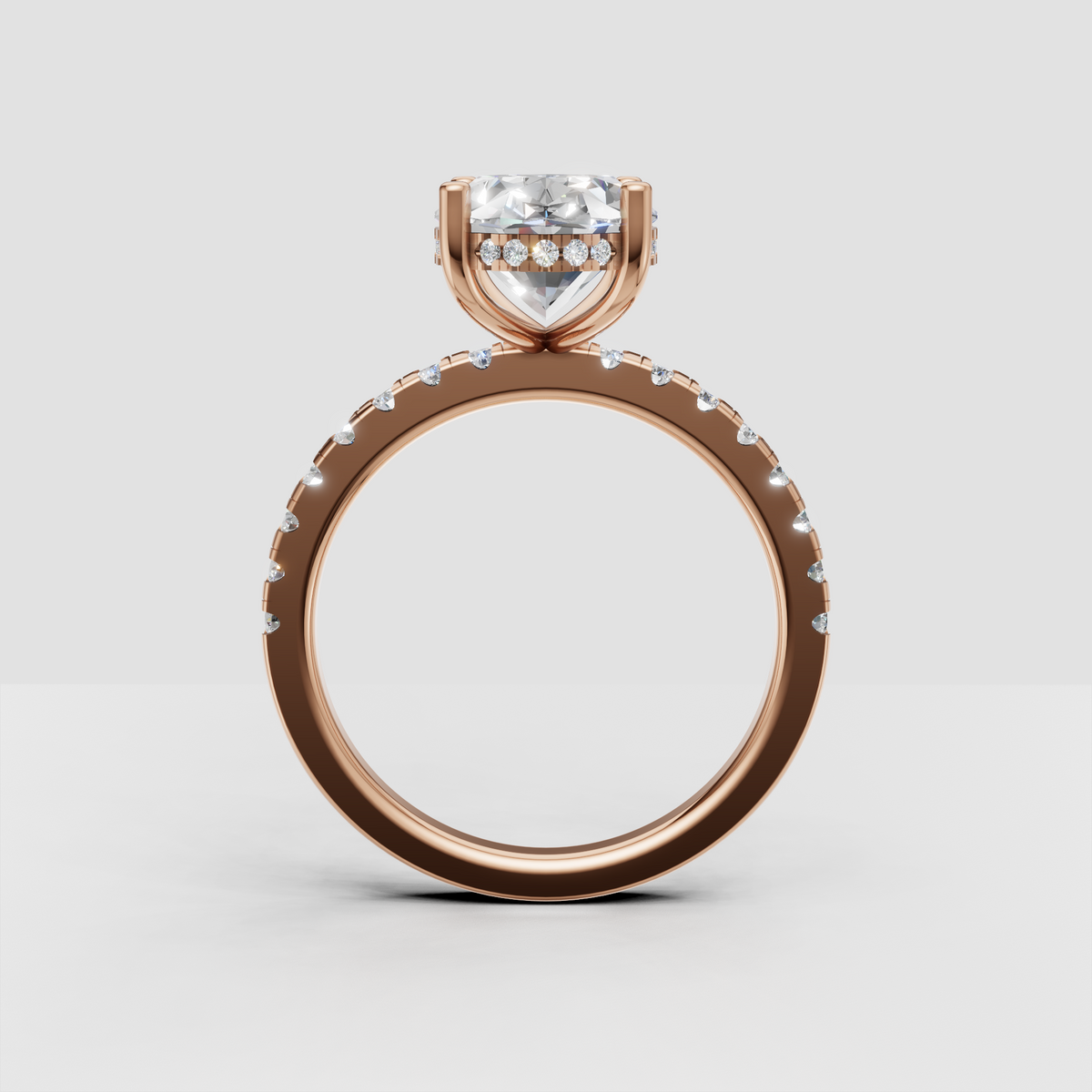 Profile view of yellow gold oval diamond ring with accent diamonds