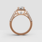 Round diamond ring featuring four rounded gold prongs and sparkling halo