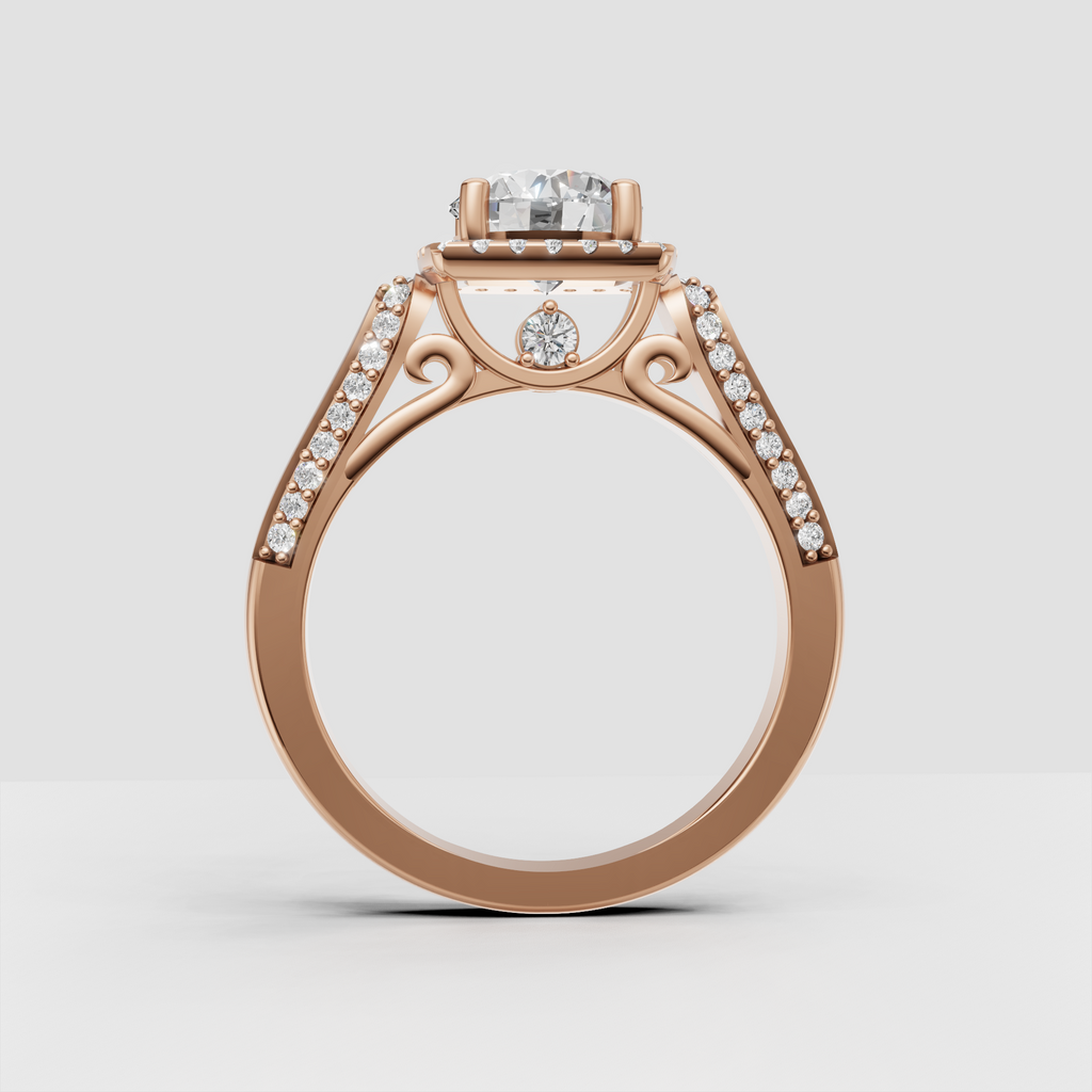 Round diamond ring featuring four rounded gold prongs and sparkling halo