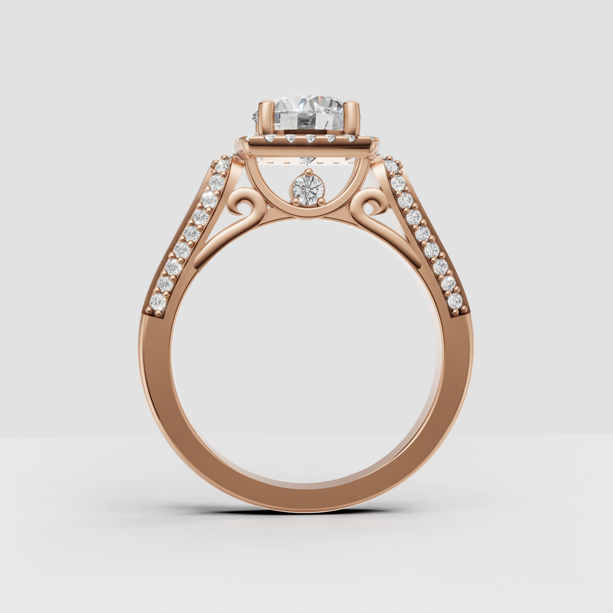 Round diamond ring featuring four rounded gold prongs and sparkling halo