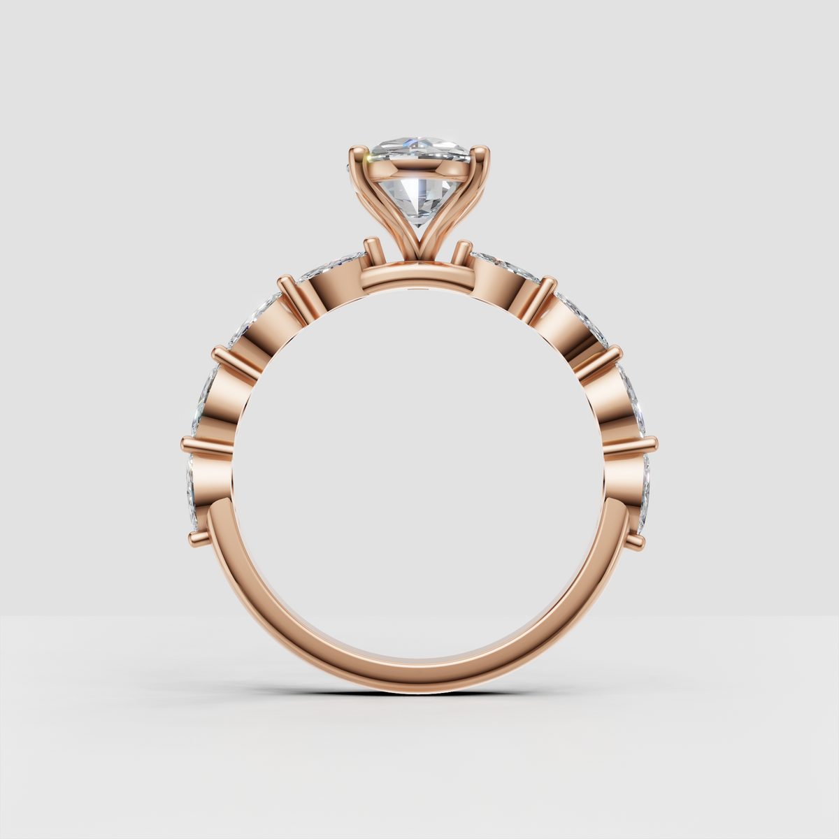 Four-prong oval diamond engagement ring in yellow gold