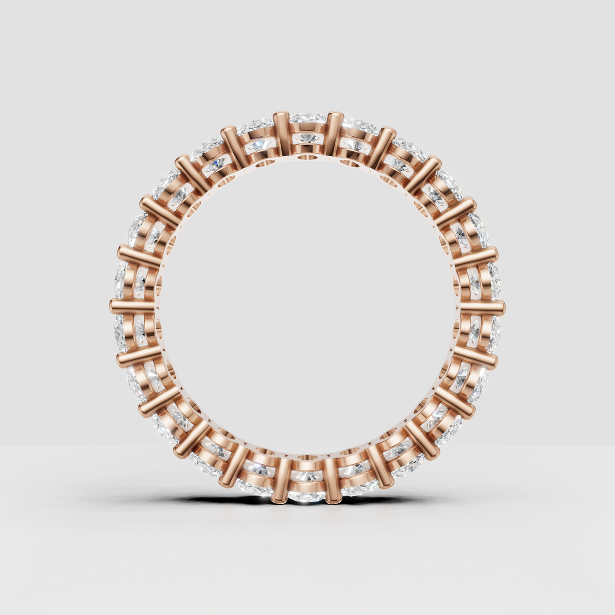 Close view of oval cut diamonds on a full eternity wedding band