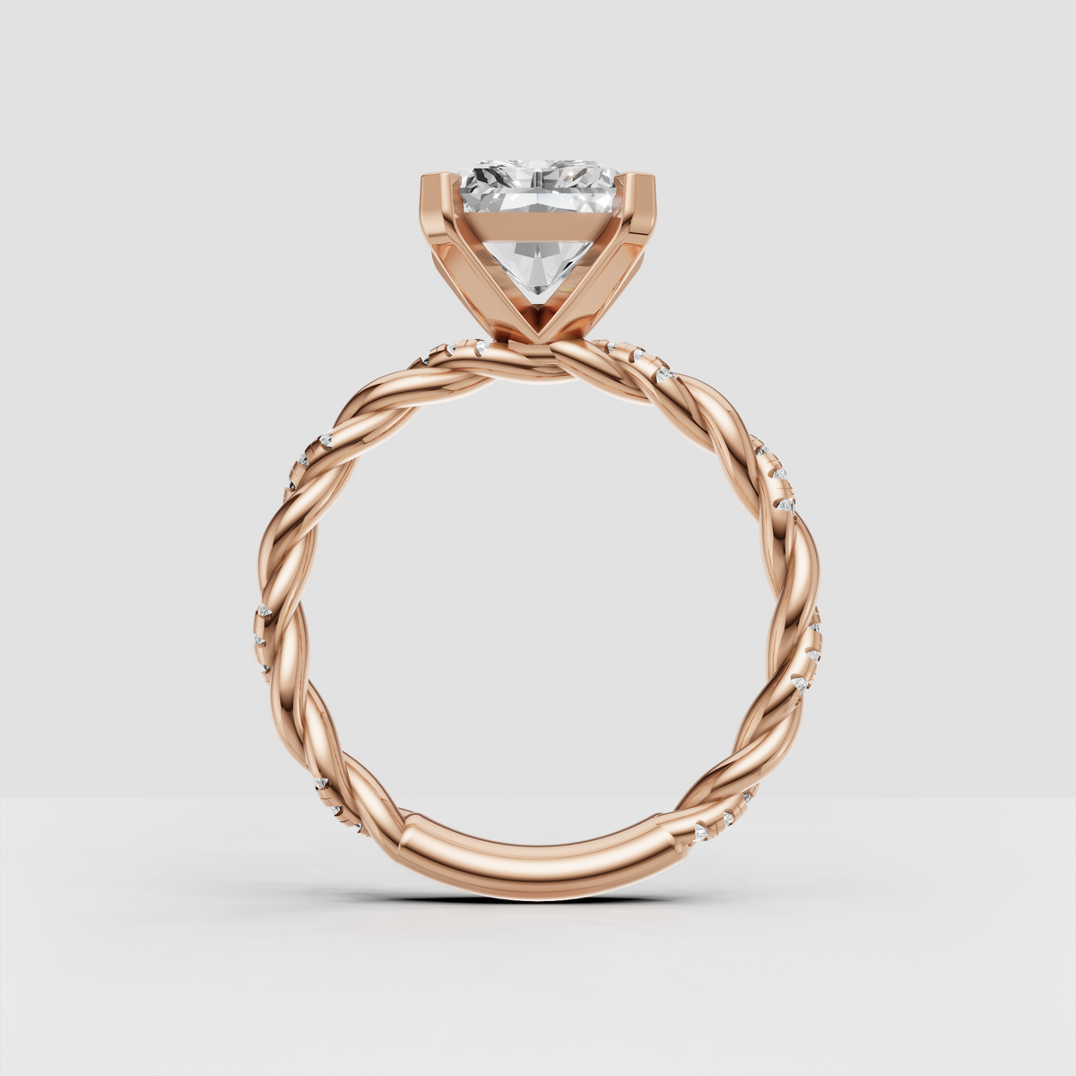 Radiant cut diamond ring with delicate round pavé diamonds