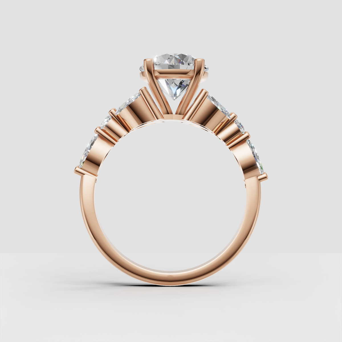 Round center stone engagement ring surrounded by marquise diamond accents