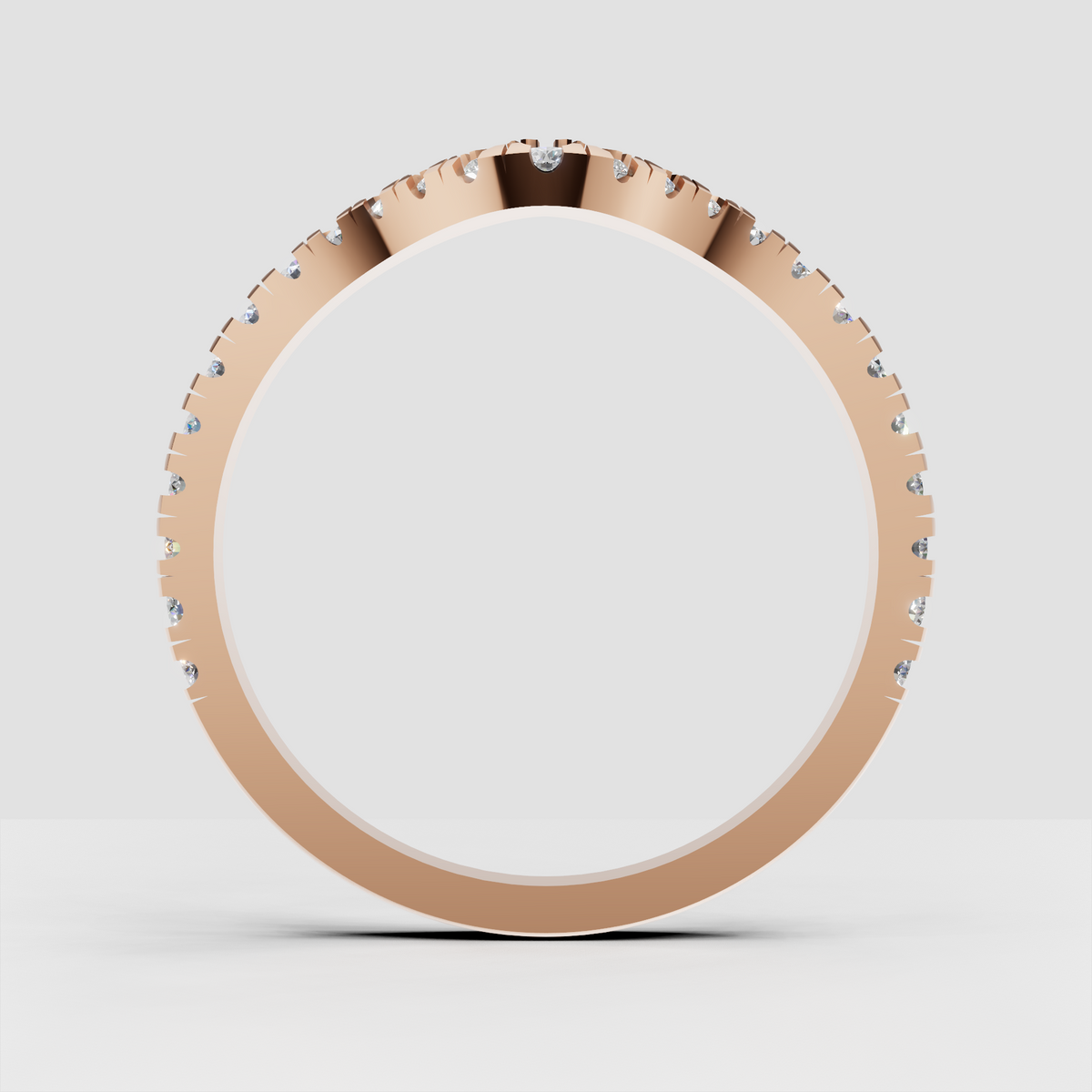 Chevron-style diamond wedding band with prong-set round stones