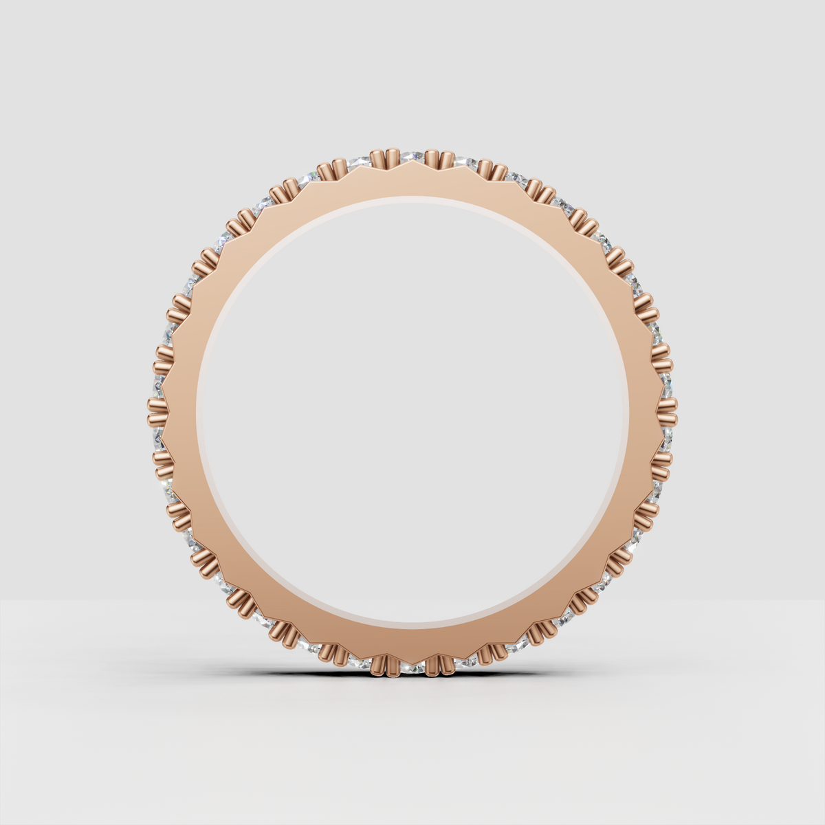 Detailed round cut diamond eternity band in rose gold