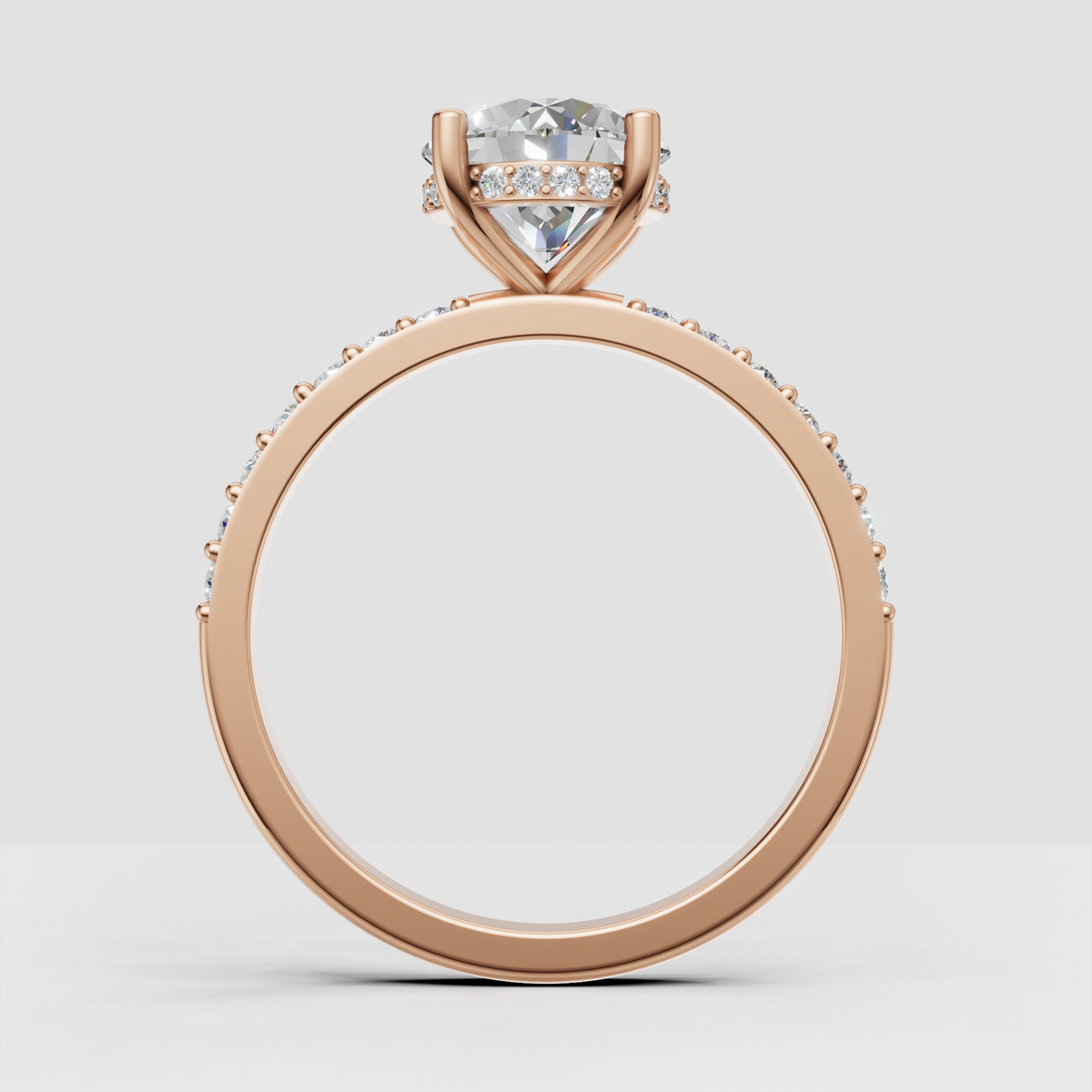 Four-prong diamond engagement ring with intricate under-gallery detailing