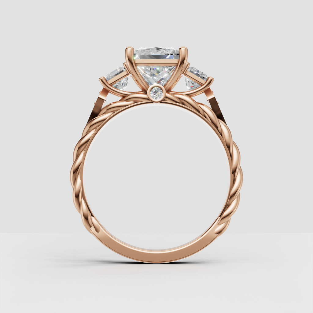 Three stone princess cut diamond ring with leaf inspired details