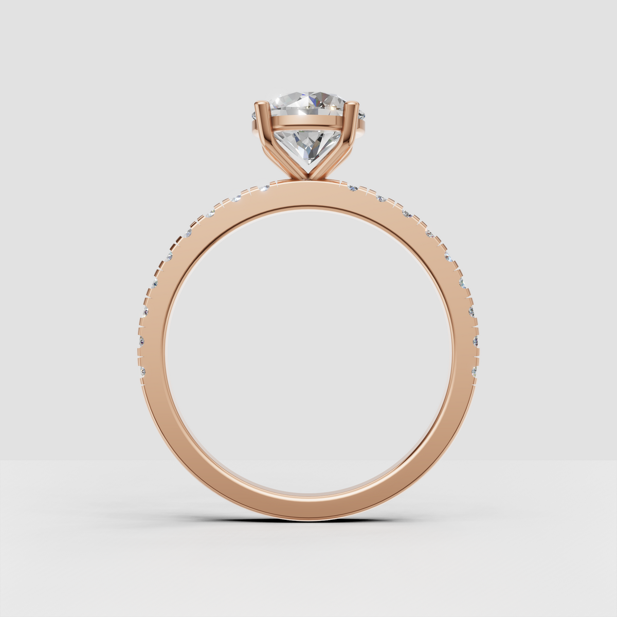 Round diamond solitaire ring with diamond-accented shoulders