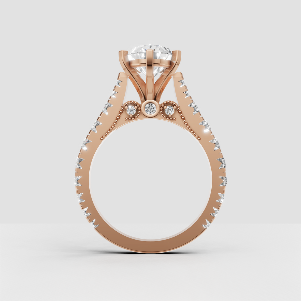 Pear diamond engagement ring with detailed milgrain undergallery