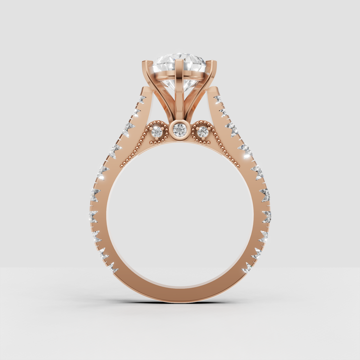 Pear diamond engagement ring with detailed milgrain undergallery