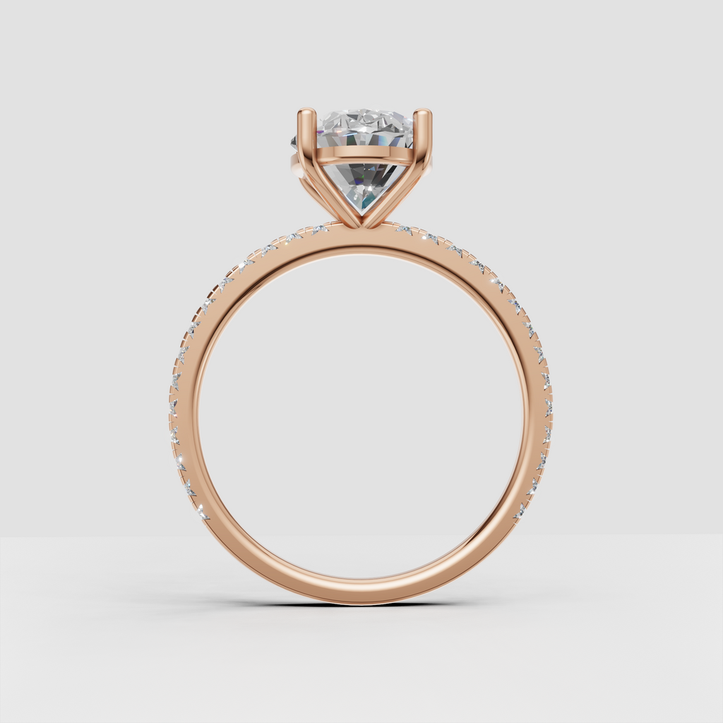 Detailed oval engagement ring with pavé-set diamond shoulders