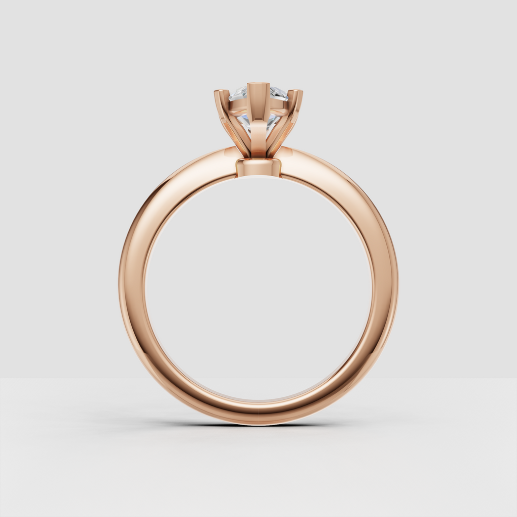 Side view of marquise cut diamond solitaire ring in gold
