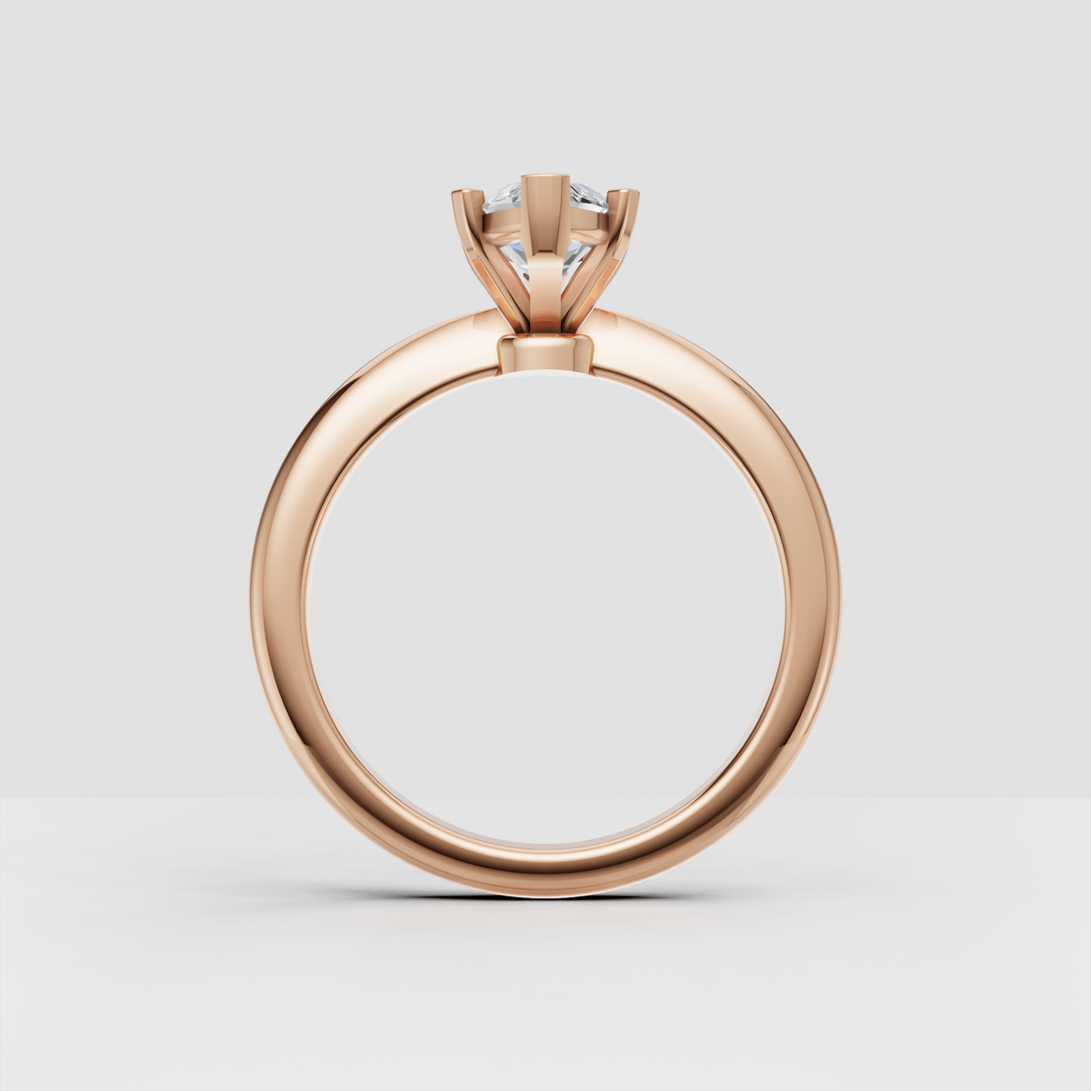 Side view of marquise cut diamond solitaire ring in gold
