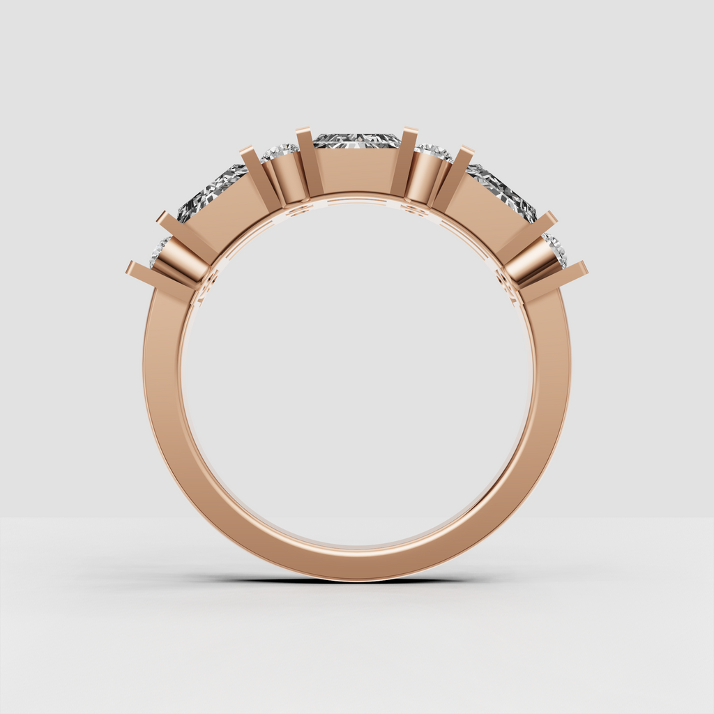 Close-up of geometric baguette and round diamond wedding band