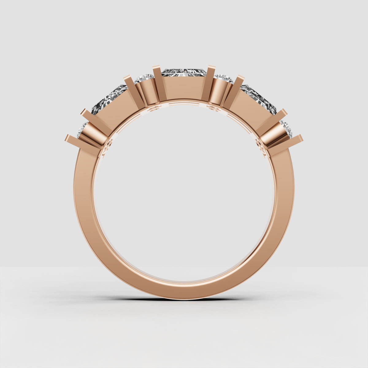 Close-up of geometric baguette and round diamond wedding band