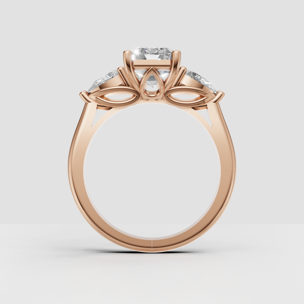 Prong set emerald cut three stone ring